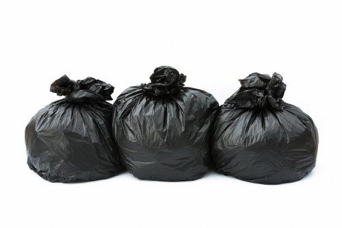 Business professionals managing waste with a commercial skip