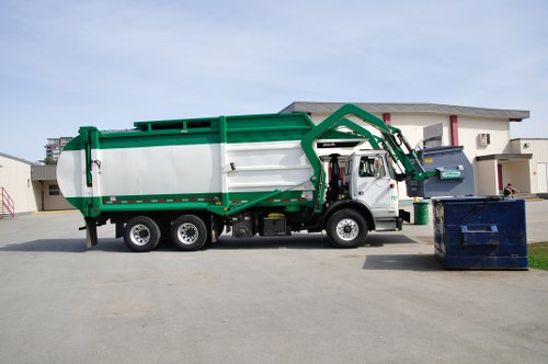 Waste being loaded into a skip for disposal